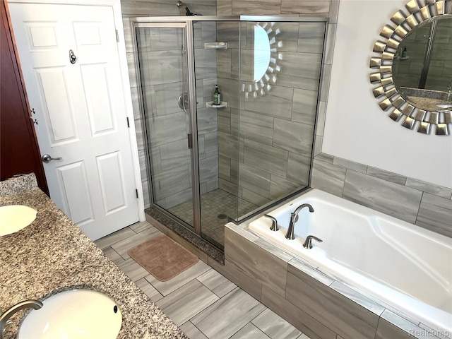 23540 Wilson Ave, Dearborn, MI 48128 - bathroom with double vanity, a shower stall, and a garden tub