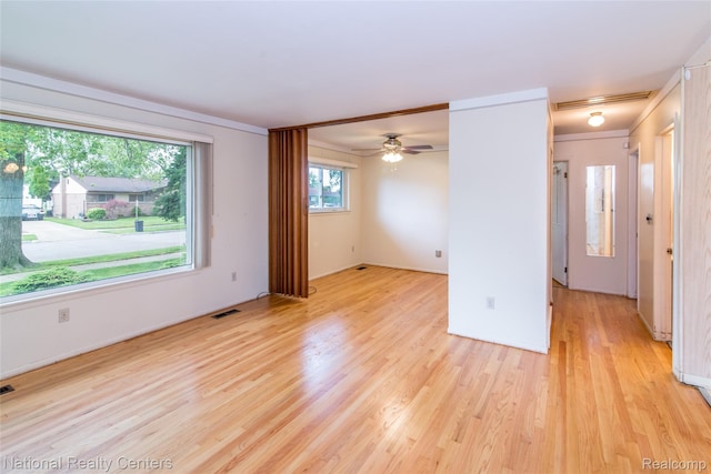 2139 Pagel Ave, Lincoln Park, MI 48146 - unfurnished room with light wood finished floors, a ceiling fan, and crown molding