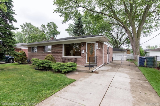 2139 Pagel Ave, Lincoln Park, MI 48146 - view of front of home with brick siding, a detached garage, and a chimney