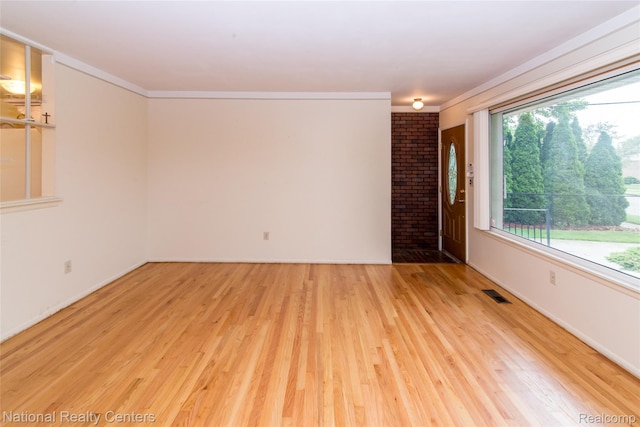 2139 Pagel Ave, Lincoln Park, MI 48146 - empty room featuring light wood-style flooring and crown molding