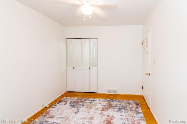 2139 Pagel Ave, Lincoln Park, MI 48146 - unfurnished bedroom with light wood-style floors, ceiling fan, and two closets