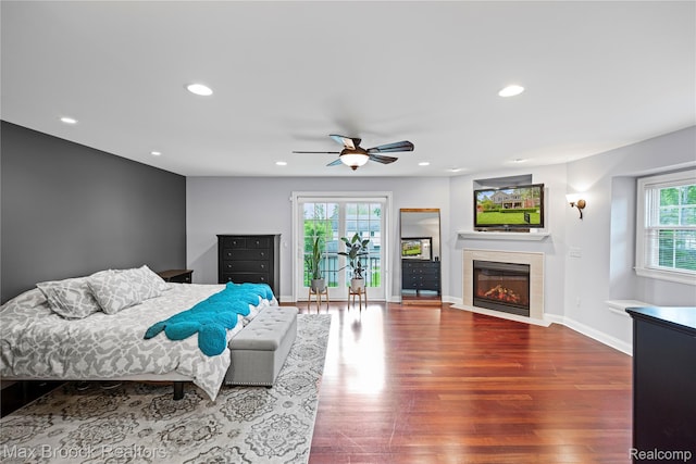 2534 Buckingham Ave, Birmingham, MI 48009 - bedroom with wood finished floors, a fireplace with flush hearth, recessed lighting, and ceiling fan