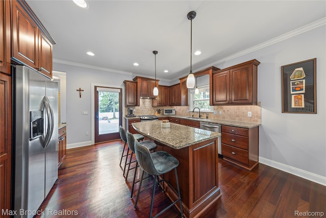 2534 Buckingham Ave, Birmingham, MI 48009 - kitchen featuring appliances with stainless steel finishes, dark wood-type flooring, plenty of natural light, backsplash, and crown molding