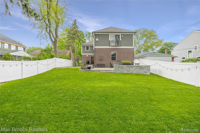 2534 Buckingham Ave, Birmingham, MI 48009 - back of property with a fenced backyard, a patio, brick siding, and a balcony