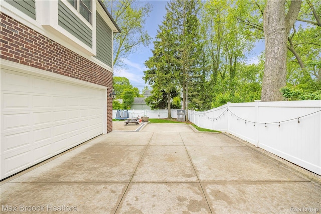 2534 Buckingham Ave, Birmingham, MI 48009 - view of patio with driveway and an attached garage