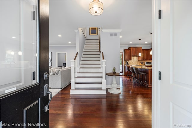 2534 Buckingham Ave, Birmingham, MI 48009 - entrance foyer with ornamental molding, dark wood-style flooring, stairway, and recessed lighting
