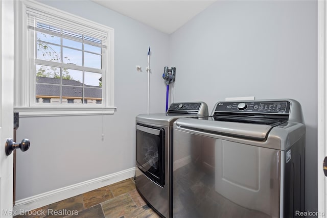 2534 Buckingham Ave, Birmingham, MI 48009 - laundry room with separate washer and dryer and dark stone finish floors