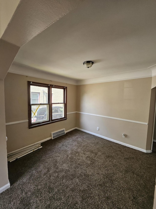 18242 Mendota St, Detroit, MI 48221 - unfurnished room featuring dark carpet and baseboards
