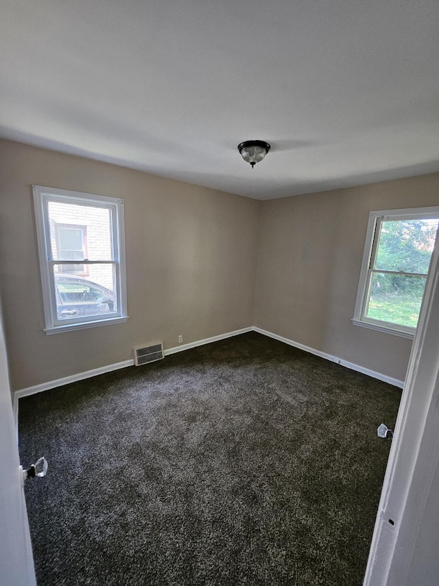18242 Mendota St, Detroit, MI 48221 - unfurnished room featuring dark colored carpet