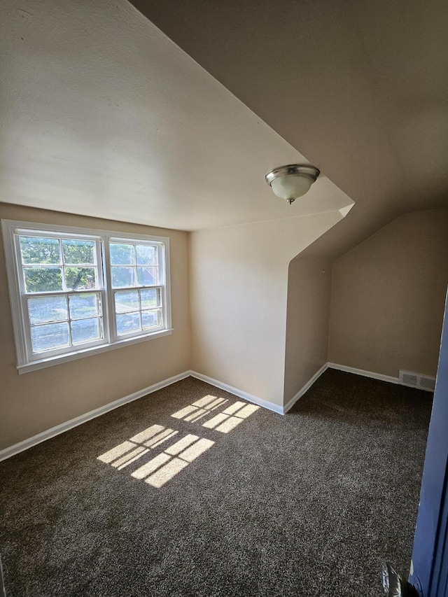18242 Mendota St, Detroit, MI 48221 - bonus room featuring dark carpet and vaulted ceiling