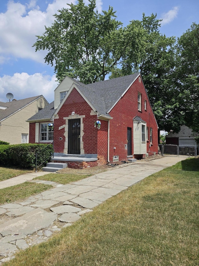 18242 Mendota St, Detroit, MI 48221 - bungalow-style home featuring brick siding, entry steps, and roof with shingles