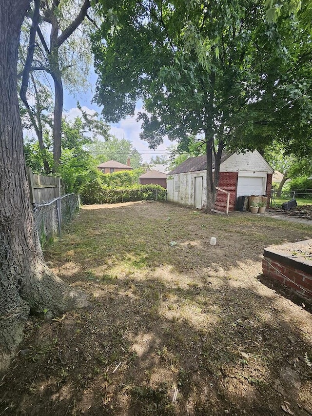 18242 Mendota St, Detroit, MI 48221 - view of yard with a detached garage