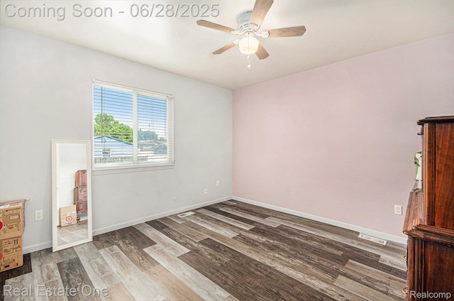 1465 E Judd Rd, Burton, MI 48529 - empty room featuring ceiling fan and wood finished floors