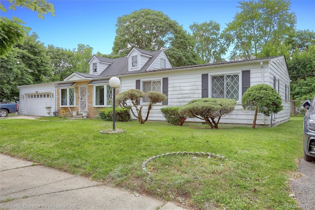 637 Arthur Ave, Pontiac, MI 48341 - cape cod house featuring an attached garage and a front yard