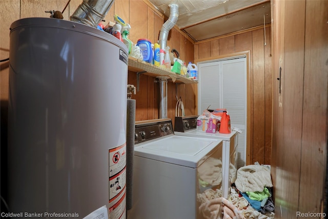 637 Arthur Ave, Pontiac, MI 48341 - laundry area with water heater, washing machine and dryer, and wood walls