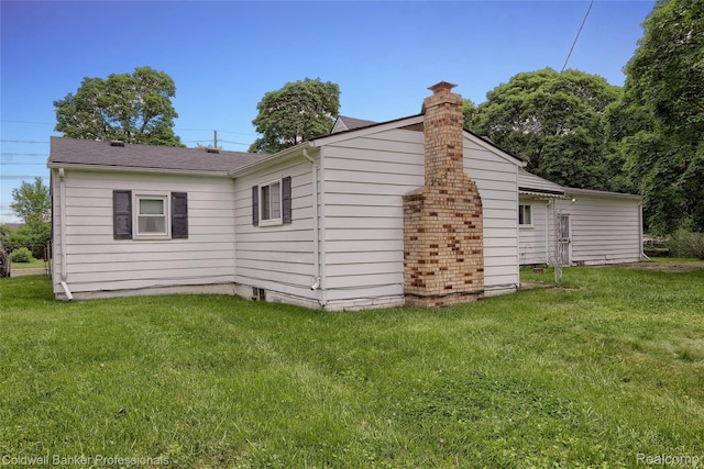 637 Arthur Ave, Pontiac, MI 48341 - view of side of home featuring a chimney and a lawn
