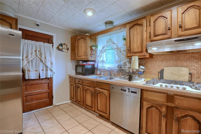 637 Arthur Ave, Pontiac, MI 48341 - kitchen featuring stainless steel appliances, under cabinet range hood, light countertops, decorative backsplash, and crown molding