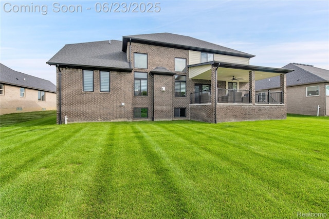 56727 Via Carlotta, Shelby Twp, MI 48042 - back of house featuring brick siding, a yard, and ceiling fan