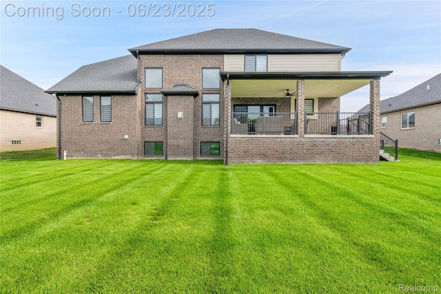 56727 Via Carlotta, Shelby Twp, MI 48042 - back of property with brick siding, a lawn, and ceiling fan
