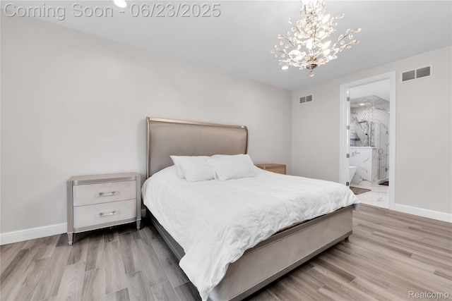 56727 Via Carlotta, Shelby Twp, MI 48042 - bedroom featuring a chandelier, wood finished floors, and ensuite bathroom