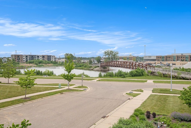 994 Harbor Dr E, Saint Joseph, MI 49085 - view of asphalt street featuring sidewalks, a water view, and curbs