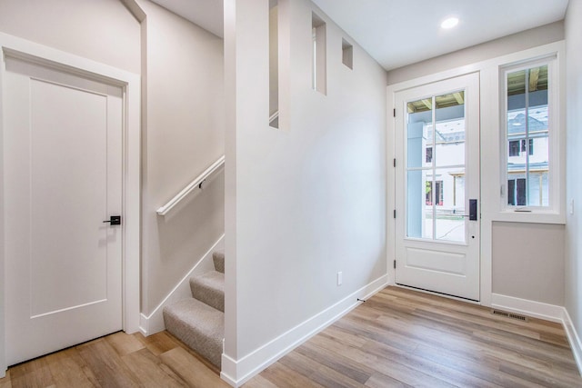 994 Harbor Dr E, Saint Joseph, MI 49085 - entryway featuring light wood finished floors and stairs