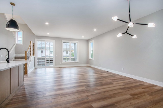 994 Harbor Dr E, Saint Joseph, MI 49085 - unfurnished living room with healthy amount of natural light, wood finished floors, and recessed lighting
