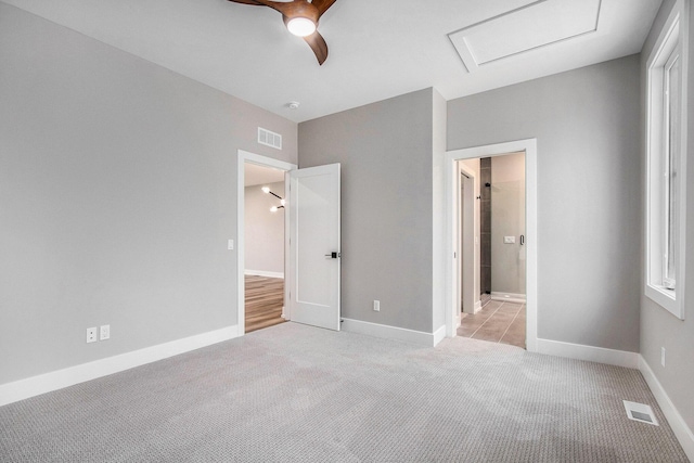994 Harbor Dr E, Saint Joseph, MI 49085 - unfurnished bedroom featuring light colored carpet, attic access, and a ceiling fan