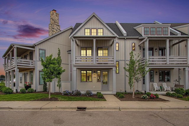 994 Harbor Dr E, Saint Joseph, MI 49085 - multi unit property with a balcony, board and batten siding, and a chimney