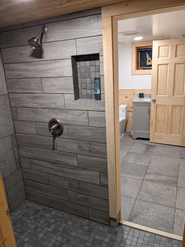 539 Sunset Ln, East Lansing, MI 48823 - bathroom featuring a tile shower and toilet