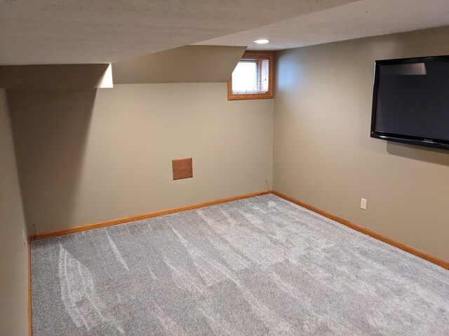 539 Sunset Ln, East Lansing, MI 48823 - below grade area featuring carpet floors and baseboards