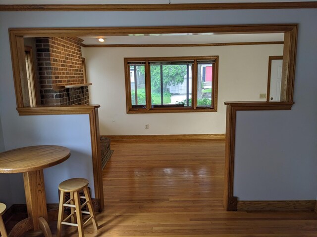 539 Sunset Ln, East Lansing, MI 48823 - dining area with wood finished floors and crown molding