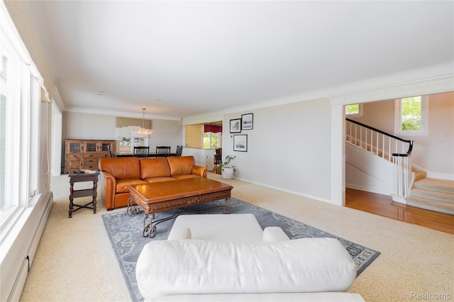 19891 Parke Ln, Grosse Ile, MI 48138 - living area with light colored carpet, stairs, and baseboard heating