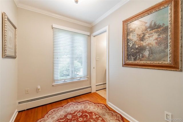 19891 Parke Ln, Grosse Ile, MI 48138 - empty room with a baseboard heating unit, wood finished floors, and crown molding
