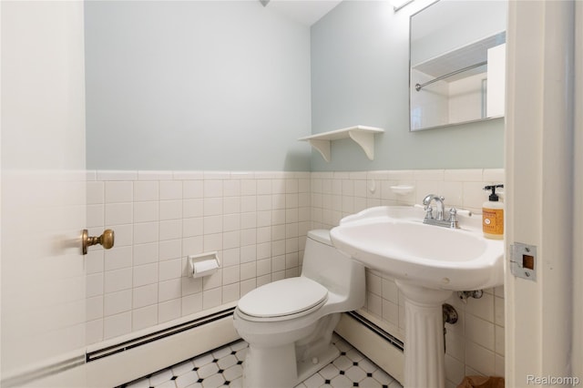19891 Parke Ln, Grosse Ile, MI 48138 - half bathroom with a baseboard heating unit, tile walls, and wainscoting