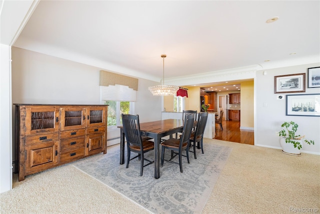 19891 Parke Ln, Grosse Ile, MI 48138 - carpeted dining space featuring a chandelier and baseboard heating