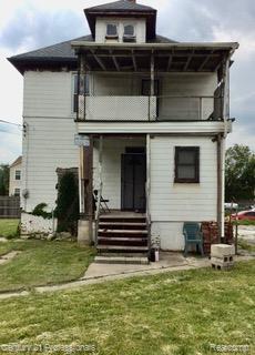 2118 Vinewood St, Detroit, MI 48216 - back of house with a balcony, a yard, and a porch