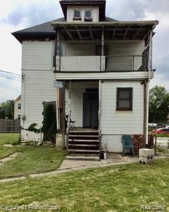 2118 Vinewood St, Detroit, MI 48216 - back of property featuring a balcony and a porch