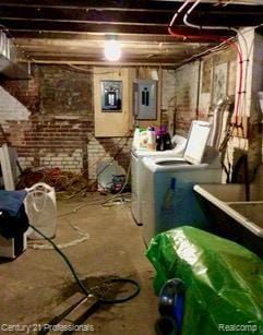 2118 Vinewood St, Detroit, MI 48216 - unfinished below grade area featuring washing machine and dryer, electric panel, and brick wall
