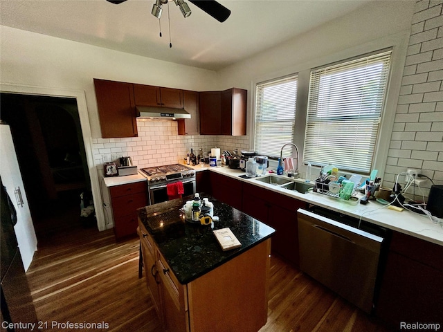 2118 Vinewood St, Detroit, MI 48216 - kitchen featuring stainless steel gas range, dishwasher, dark wood-style flooring, a ceiling fan, and decorative backsplash