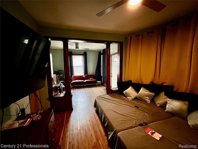 2118 Vinewood St, Detroit, MI 48216 - bedroom featuring decorative columns, hardwood / wood-style flooring, and ceiling fan
