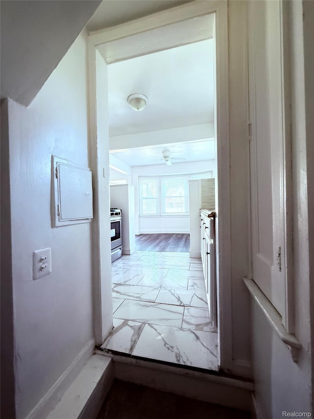 9941 Minock St, Detroit, MI 48228 - corridor featuring light marble finish flooring and baseboards