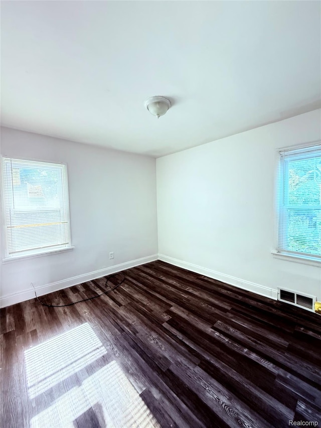 9941 Minock St, Detroit, MI 48228 - spare room with dark wood-style floors and baseboards