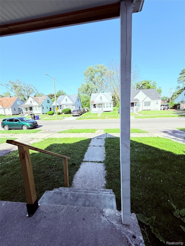 9941 Minock St, Detroit, MI 48228 - view of green lawn with a residential view