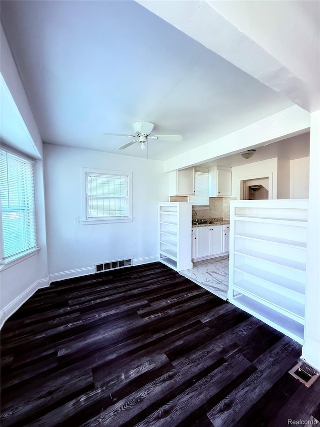 9941 Minock St, Detroit, MI 48228 - unfurnished living room featuring wood finished floors and a ceiling fan