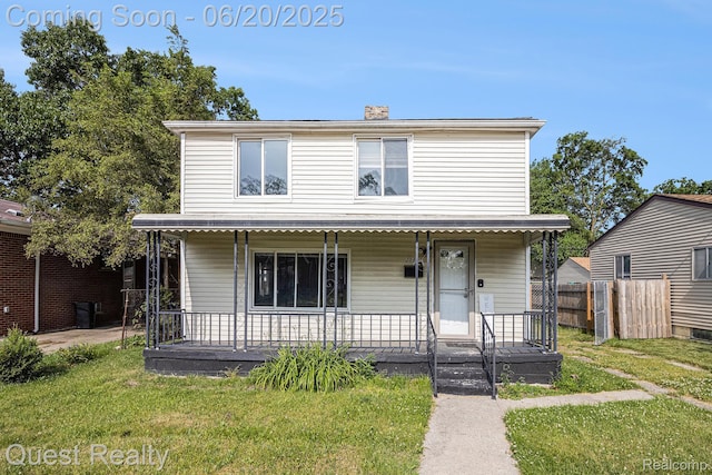 20863 Garden Ln, Ferndale, MI 48220 - view of front facade featuring a porch and a chimney