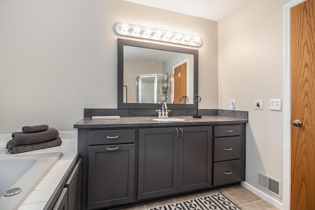 1320 Patricia Ave, Ann Arbor, MI 48103 - bathroom featuring vanity, a shower with door, and tile patterned flooring