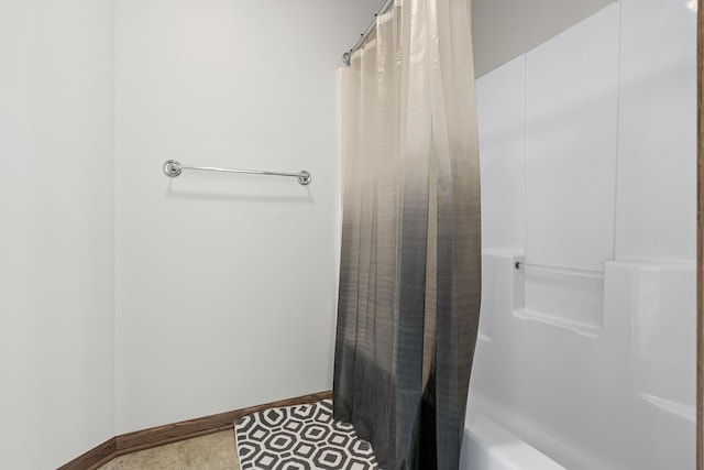 1860 Partridge Ln, Kalamazoo, MI 49009 - bathroom with shower / tub combo and baseboards