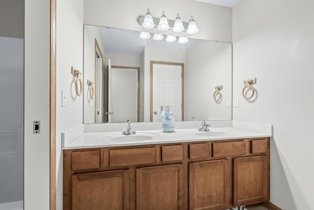 1860 Partridge Ln, Kalamazoo, MI 49009 - bathroom featuring double vanity and a shower stall