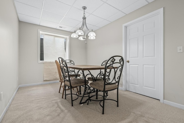 1860 Partridge Ln, Kalamazoo, MI 49009 - dining room featuring light carpet, a paneled ceiling, and a chandelier